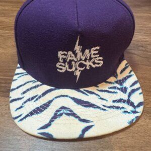 Vintage Hall of Fame “Fame Sucks” Snapback Cap – Purple / Zebra Print Brim